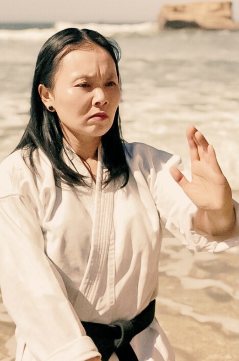 Sensei Sheryn Gung in ‘Heaven-Earth-Man’ position, in front of Bird Rock in Jan Juc Surf Beach, Jan Juc, Surf Coast.