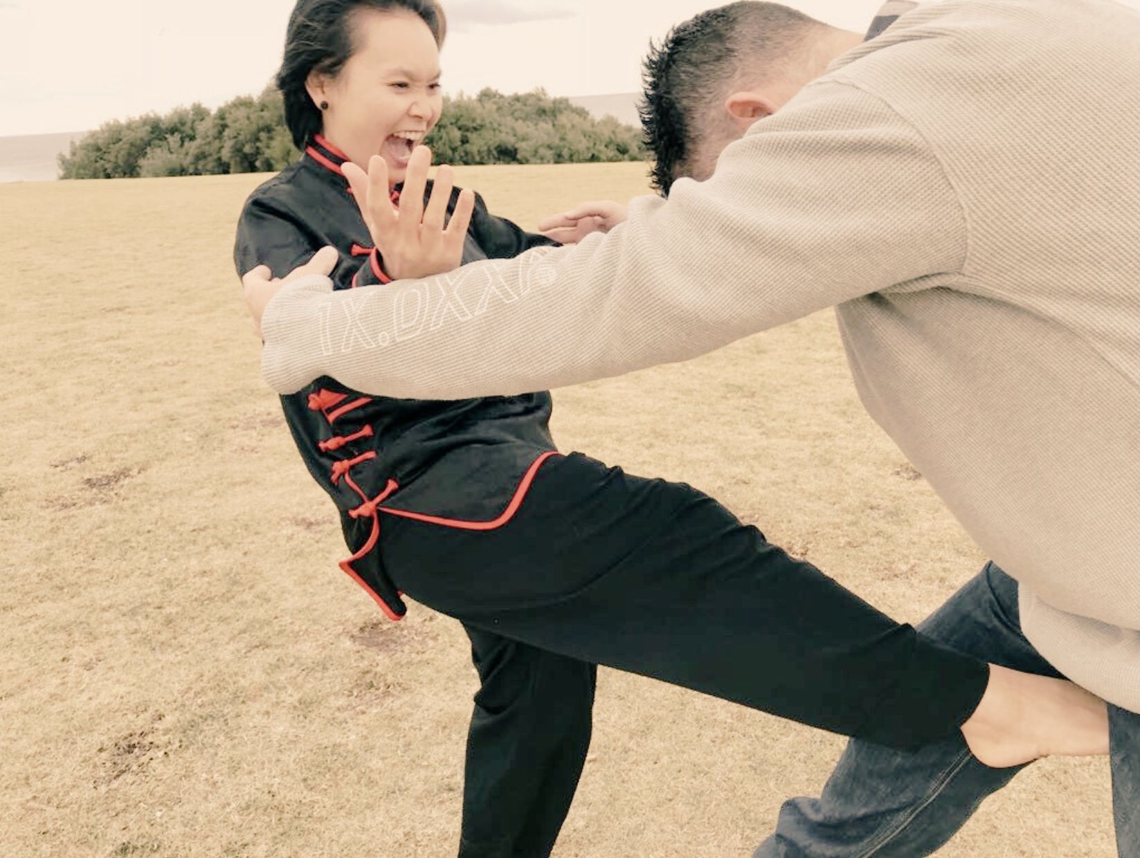 Sheryn Gung and Ross McDonald practising self-defence in Torquay, Surf Coast